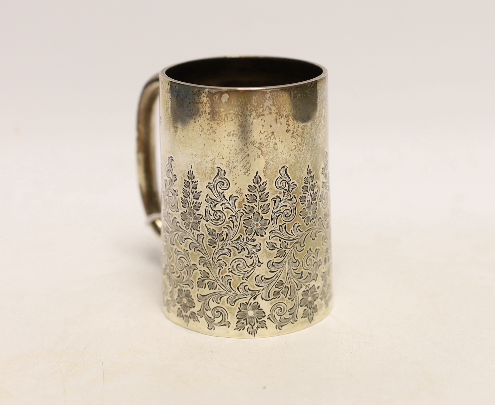 A Victorian engraved silver christening mug, maker's mark rubbed, London, 1888, 89mm, 145 grams.